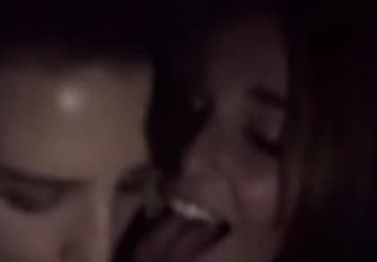 Two Girls Giving a Blowjob in a Movie Theater